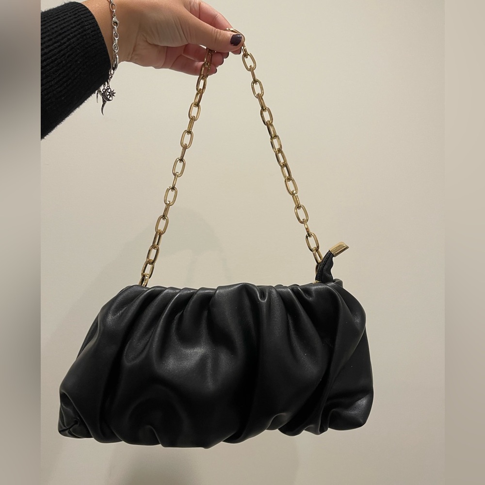 Black purse with golden details